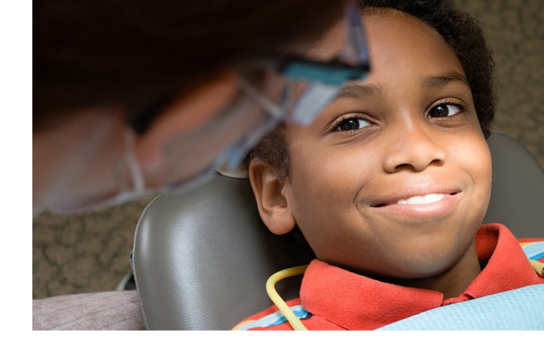 Boy at dentist office for laser treatment of canker sores