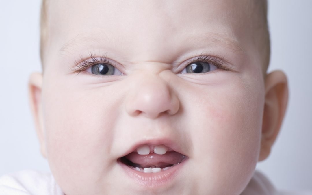 Baby smiling with teeth for take child to dentist article